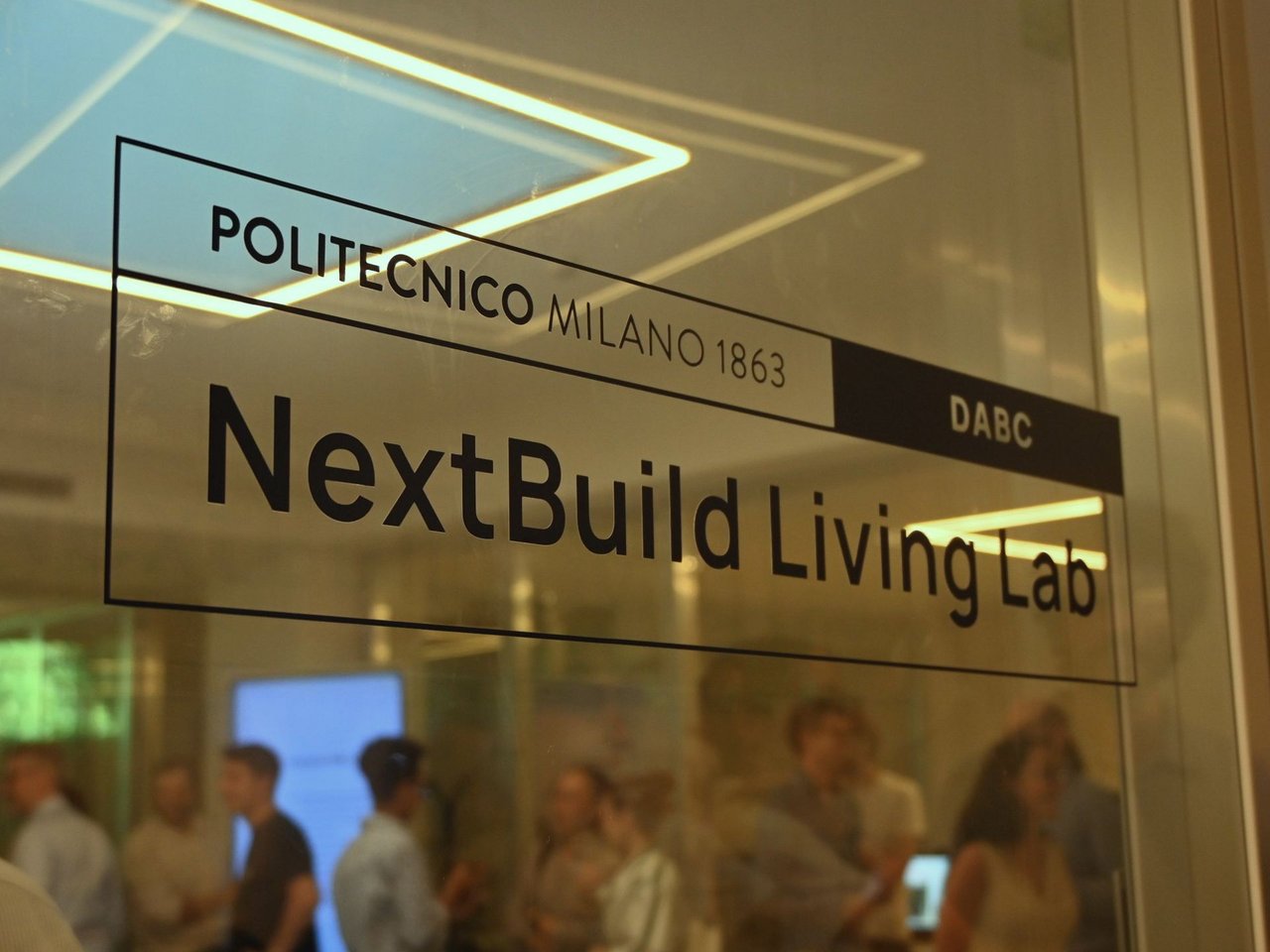 Logo di NextBuild Living Lab class=